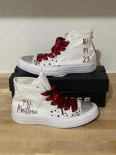 These custom high top white converse are a unique addition to your wedding day, Perfect for dancing the night away. Great gift idea for yourself or your bridesmaids. Each pair is fully customizable for you!  DESIGN AND TEXT  ⭐️ You can choose any text for each shoe ⭐️ If you are imagining something else for the design, message me and we can make your dreams come true  ⭐️ We do offer different color converse for an additional charge, message me with your color choice  ⭐️ We offer most colors for White High-top Wedding Sneakers, Custom White High-top Wedding Sneakers, Color Converse, Converse High Top, Shoes Bride, Ribbon Laces, Wedding Sneakers, Pearl Decorations, Make Your Dreams Come True