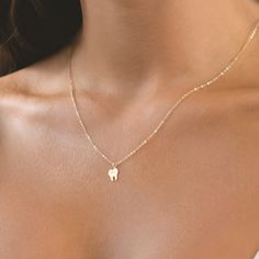 Discover our charming Tooth Necklace, a delightful homage to dental professionals and a symbol of oral health and wellness. Carefully crafted with attention to detail, this necklace is available in your choice of premium gold filled, sterling silver, or rose gold filled materials, ensuring both style and durability. 🦷  ✨ High-Quality Materials: Choose from luxurious gold filled, sterling silver, or rose gold filled options, meticulously crafted to maintain their shine and luster for years to co Dentist Graduation, Dental Jewelry, Tooth Jewelry, Gold Tooth, Dental Assistant Gifts, Tooth Charm, Tooth Pendant, Initial Disc Necklace, Engraved Bar Necklace