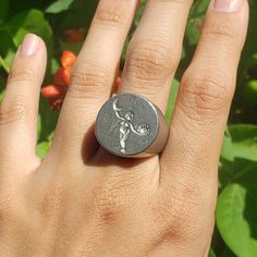 This signet ring is cast in lead-free pewter. The ring size when cast is 7.25. The sealing image is the sun and moon orbiting a figure.       This is part of a series of signet rings I am making cast from lead-free pewter. Each master ring is hand sculpted to give a unique, rustic style, multi-dimensional relief image when used as a stamp to seal, with sealing wax. Symbolic Round Hand Cast Signet Ring, Hand Cast Signet Ring As Gift, Vintage Hand-cast Round Signet Ring, Moon Orbit, Moon Circle, The Sun And Moon, Signet Rings, Sealing Wax, Circle Ring