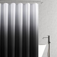 a black and white shower curtain in a bathroom