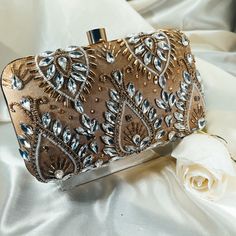 If a show-stopper is what you're in the market for, this crystal-studded evening clutch will add a serious kick to your wardrobe!   Size: 8×4 inches Shoulder strap included. Glamorous Embellished Evening Bag For Events, Glamorous Hand Embellished Evening Bag For Events, Glamorous Hand-embellished Evening Bag For Events, Luxury Bedazzled Evening Bag For Party, Elegant Embellished Evening Bag For Party Season, Hand Embellished Rectangular Evening Bag For Party, Glamorous Hand Embellished Evening Bag, Glamorous Embellished Bag For Gala, Elegant Embellished Bags For Party Season