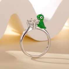 Daspletosaurus, also known as Tyrannosaurus, is a genus of dinosaurs under the family Tyrannosaurus that lived in western North America during the Upper Cretaceous period, 77 million to 74 million years ago. This Jeulia Hug Me® ring is made of sterling silver, vividly presenting the cute posture of a cartoon daspletosaurus. It will be perfect gift for dinosaur lovers or just add an special addition to your jewel collection. You will find more adorable and creative designs in our Hug Me® collecti Me Cartoon, Cretaceous Period, Cartoon Dinosaur, Hug Me, A Cartoon, Buy One Get One, Creative Designs, Black Friday Sale, Dinosaurs