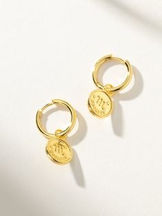 Show off your zodiac sign with these gold textured coin pendant huggies. Stack our Zodiac Huggies with other gold hoop earrings to create your own set or with simple studs to make these your statement earrings. Complete the look:Zodiac Ring Simple Studs, Uncommon James, Zodiac Rings, Jewelry Cleaner, Coin Pendant, Gold Texture, Gold Hoop, Huggies Earrings, Gold Hoop Earrings