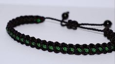 Black braided bracelet with a  green Line, adjustable wristband -new -handmade -for man & woman Adjustable Green Friendship Bracelets, Green Beaded Bracelets With Adjustable Cord For Friendship, Green Resizable Friendship Bracelet, Adjustable Green Beaded Bracelets With Sliding Knot, Green Beaded Bracelets With Adjustable Length, Casual Braided Beaded Bracelets As Gift, Casual Braided Beaded Bracelets For Gift, Black Braided Casual Friendship Bracelets, Adjustable Resizable Green Jewelry