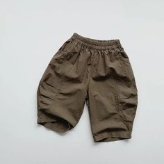 Baggy Cargo Pants For Summer Outdoor Activities, Cotton Cargo Pants With Elastic Waistband For Outdoor Activities, Cotton Cargo Pants With Elastic Waistband For Outdoor, Summer Parachute Pants With Pockets For Outdoor, Summer Parachute Pants With Side Pockets For Outdoor, Summer Outdoor Parachute Pants With Side Pockets, Summer Baggy Bottoms With Elastic Waistband, Solid Color Summer Bottoms For Outdoor, Solid Color Summer Outdoor Bottoms