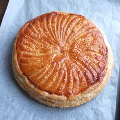 a pastry sitting on top of a piece of wax paper