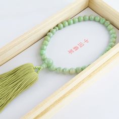 Chinese Jade Stone Buddhist Prayer Beads Characteristics of the product Material : Chinese Jadeite, Silk cord Head bead : about 10mm (0.39in) Main bead : about 8mm (0.31in) Inner circumference : about 25cm (9.84in) Tassel length : about 9cm (3.54in) Handmade in Kyoto, JAPAN About Chinese Jade Chinese jade refers to the jade mined or carved in China from the Neolithic onward. It has long been prized by the Chinese who called it "The heavenly gem", Confucius himself thought it was the representati Jade Beads With Large Beads For Gifts, Gift Jade Beads With Large Beads, Round Jade Beads For Gifts, Elegant Jade Beads As Gift, Jade Beads Gift, Jade Beaded Necklaces With Large Beads For Gifts, Hand-strung Jade Beads For Jewelry Making, Hand-strung Jade Beaded Necklaces With Round Beads, Adjustable Jade Beaded Necklace With 8mm Beads