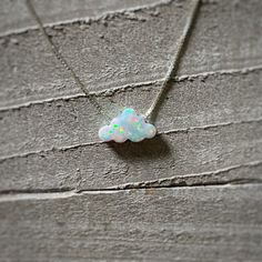 "Tiny Opal Cloud/White Fire Opal/Birthday Gift For Her/October Birthstone/Minimalist Necklace/Dream Big/Celestial Jewelry/Little Charm/Clouds ** Ships out in 1-2 business days! ** Adorable White Opal Cloud Charm that will come on a Sterling Silver or Gold Filled Box Chain. Very dainty, perfect minimalist necklace! - Opal measures approx. 12mm x 7.3mm - 100% Solid .925 Sterling Silver or 14/20 Gold Filled Box Chain ** Choose your desired chain length from the drop down menu. If you are unsure of White Celestial Necklace With Adjustable Chain, Celestial White Necklace With Adjustable Chain, White Opal Jewelry Gift, Spiritual White Birthstone Necklaces, Spiritual White Jewelry For Gifts, Spiritual White Jewelry As A Gift, Handmade White Celestial Jewelry, Spiritual White Jewelry With Birthstone, Whimsical White Necklace Perfect For Gifts