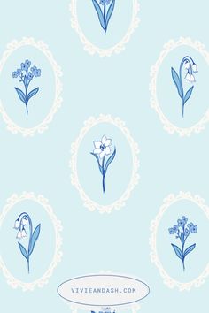 blue and white flowers are arranged in a circle on a light blue wallpaper background