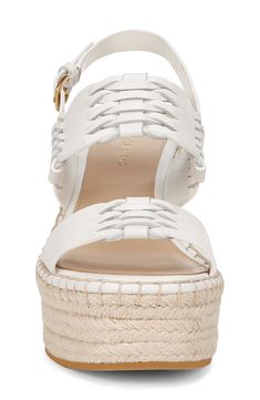 Interwoven leather straps lend visual intrigue to an espadrille-inspired slingback sandal lifted by a jute-wrapped platform and soaring wedge heel. 4 1/4" heel; 1 3/4" platform (size 8.5) Adjustable slingback strap with buckle closure Leather upper and lining/rubber sole Imported Chic Slingback Espadrilles For Beach, Chic Wedge Sandals With Braided Straps, Leather Espadrilles With Heel Strap For Beach, Spring Leather Espadrilles With Heel Strap, Spring Slingback Platform Espadrilles, Spring Platform Slingback Espadrilles, Leather Wedge Sandals With Braided Straps For Summer, Leather Wedge Sandals With Braided Straps For Spring, Chic Beach Slingback Espadrilles