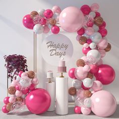 balloons and confetti decorate the backdrop for a happy day party with pink, white, and gold accents