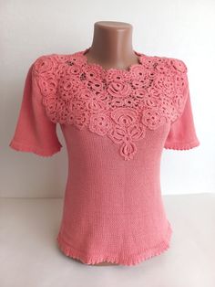 Introducing a charming addition to your wardrobe: a meticulously crafted crochet blouse exuding elegance and femininity.  This stunning women's blouse showcases the intricate artistry of Irish lace, elevating its allure with delicate motifs and fine craftsmanship. Fashioned in a soft, dreamy pink hue, this summer essential embodies grace and sophistication, perfect for warm-weather outings and leisurely strolls.  Handcrafted from premium cotton yarn, this crochet blouse offers comfort alongside Feminine Crochet Lace Blouse, Fitted Lace Top With Crochet Trim, Fitted Bohemian Crochet Crew Neck Top, Feminine Blouse With Crochet Trim, Elegant Lace Top With Crochet Trim, Elegant Fitted Lace Top With Crochet Trim, Elegant Short Sleeve Cotton Lace Top, Bohemian Crochet Lace Crew Neck Tops, Elegant Crochet Top With Lace Trim And Short Sleeves