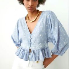 Nwt Zara Linen Blouse With Contrast Embroidery Size S Brand New No Flaws - Blue And White Embroidered -Size S -66% Cotton 34% Linen -Embroidered -V-Neck -Cropped -Button Front -Long Balloon Sleeves -Babydoll Style -Ruffle Hem -Brand New Puffed Sleeves Blouse, Checkered Blouse, Knotted Blouse, Long Sleeve Wrap Top, Black Sheer Blouse, Eyelet Blouse, Draped Blouse, Layered Blouse, Balloon Sleeve Blouse