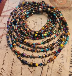 Natural, earthy beaded wrap/layer necklace with texture,  multicolor and different size stone, gemstone, cork, wood, vintage and new beads. This listing is for 2 different sizes, 46" and 50". All have a black snap button closure that's easy on/off, arthritis friendly.    MORE JEWELRY: https://www.etsy.com/shop/LandofBridget?ref=seller-platform-mcnav§ion_id=46941325  If you have any questions please feel free to contact me! Have a wonderful day! https://landofbridget.etsy.com ~ I SHIP ALL ORDERS Festival Gemstone Beads Wrap Bracelet, Festival Wrap Bracelet With Round Gemstone Beads, Unique Multi-strand Jewelry With Spacer Beads, Bohemian Beaded Wrap Bracelet For Layering, Bohemian Multi-strand Hand Wrapped Beads, Hand Wrapped Multi-strand Jewelry For Festivals, Bohemian Wrap Bracelet For Layering, Bohemian Hand Wrapped Jewelry For Layering, Bohemian Multi-strand Spacer Beads Jewelry