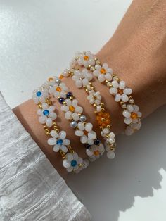 cute beaded bracelets in daisy design Daisy Beaded Bracelet | different colors: gold, white, rose, orange, blue | Daisy | Pearls | Pearl Jewelry | Miyuki / glass beads Handmade White Crystal Bracelet With Flower Shape, Handmade White Crystal Bracelet In Flower Shape, Handmade White Crystal Flower Bracelet, White Delicate Adjustable Friendship Bracelets, White Dainty Beaded Bracelet With Flower Charm, Delicate White Adjustable Friendship Bracelets, Delicate Adjustable White Friendship Bracelets, Dainty White Beaded Bracelet With Flower Charm, White Dainty Flower Shaped Beaded Bracelets