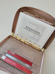 an open purse with some cards inside of it