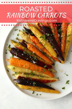 roasted rainbow carrots on a white plate with parsley