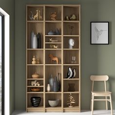 a wooden bookcase filled with lots of different items