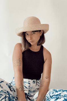 Whether you're attending rowing regattas, enjoying summer picnics, or leisurely drifting down the river, our woven raffia straw hat is the perfect companion. Featuring a timeless dome boater style with a charming flipped edge, it effortlessly combines elegance with a laid-back vibe. This is the epitome of the relaxed yet refined look we're all embracing this year. COUTONIC VINTAGE COLLECTION The COUTONIC Vintage Collection is not just a fashion collection; it's a sustainability-conscious homage Spring Coastal Boater Hat Made Of Toquilla Straw, Summer Curved Brim Boater Hat For Picnic, Summer Straw Boater Hat For Picnic, Summer Picnic Boater Hat With Curved Brim, Short Brim Panama Hat For Summer Picnics, Summer Boater Hat With Wide Brim For Picnic, Summer Curved Brim Panama Hat For Picnic, Summer Panama Hat With Curved Brim For Picnic, Summer Boater Hat With Curved Brim For Picnic