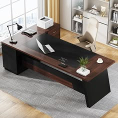 an office desk with a laptop on it