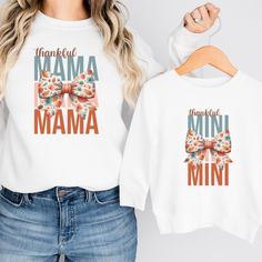 These adorable matching mommy and me sweatshirts are perfect for Fall! Available in multiple sizes and shirt styles to fit toddlers, babies, and of course mom! The sweatshirts, t-shirts, and baby bodysuits are all made of soft, high-quality fabric to keep everyone comfy and cozy this fall! How to Order Your Matching Shirts: 1) Select the first size (for either Mom or Child) from the dropdown menu. Click "Add to Cart". 2) Go back to the listing, select the second size (for the second person), and click "Add to Cart" again. 3) Repeat for as many sizes as you would like.  4) Once all the desired sizes are added to your cart, proceed to checkout! SHIRT INFORMATION & SIZING: The crewneck sweatshirt and hoodie options are Gildan Heavy Blend sweatshirts made from a blend of 50% cotton and 50% pol White Long Sleeve Matching T-shirt, Cute Crew Neck Top For Family Occasions, Family Matching Long Sleeve Tops With Custom Print, Cute Crew Neck Top, White Soft-washed Top For Mother's Day, White Long Sleeve Tops For Family Occasions, Family Matching Long Sleeve Custom Print T-shirt, Cute Name Print Tops For Fall, Cute Tops With Name Print For Fall