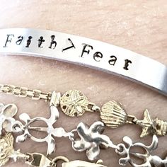 Hand Stamped 1/4 Inch Wide Aluminum Cuff Bracelet. Faith > Fear All Bracelets Are Stamped By Me. Custom Designs Upon Request. 6 Or 7 Inch Pandora Graduation Charm, Preppy Bracelets, Flexible Bracelet, Cuff Bracelets Handmade, Wood Bead Bracelet, Faux Pearl Bracelet, Gold Link Bracelet, Handmade Beauty Products, Amethyst Bracelet