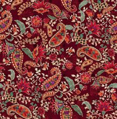 a red and green paisley print fabric with lots of different colored flowers on the side