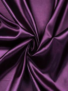 This luxurious satin fabric is perfect for your special occasion designs. Available by the yard, this 58/60 inch wide satin comes in an array of vibrant colors sure to dazzle. The medium weight brings an elegant drape and flow to any garment while maintaining a smooth, lustrous finish. Ideal for wedding and formal gowns, this satin is also suitable for accessories like sashes, headpieces and more. Sew with care as the shiny satin surface can show flaws. Pre-washing is not recommended as it may damage the silky texture. Allow extra fabric for hemming and seam allowances. Enjoy crafting stunning looks with this high quality satin fabric. Luxurious Fabric: This 60" wide satin fabric is lightweight, silky and shiny, perfect for elegant garments or home decor projects. Versatile Material: Mediu Satin Fabric Swatch, Elegant Drapes, Purple Satin, Extra Fabric, Fabric Swatches, Formal Gowns, Luxury Fabrics, Decor Project, Satin Fabric