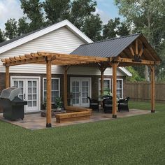 a backyard with a grill and covered patio