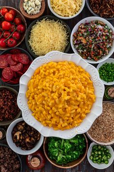 several bowls filled with different types of food on top of a table next to each other