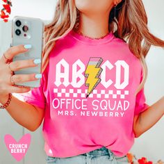 This custom office squad shirt is retro, trendy, and fun! The perfect teacher gift:) Our Bella+Canvas tees have that light and vintage feel. ♥ Our Comfort Colors tees are garment-dyed for that trendy distressed look. ♥ 》 》HOW TO ORDER 《 《 * Select product, size + color from the drop down menus * Add to cart + place order ♥ * Your shirt is now in production & will be ready to ship in 1-3 days! 》 》SIZING 《 《 These tees are unisex, men's cut tops. The Bella Canvas tees run longer than normal and slightly small - so I would NOT downsize. The Comfort Colors tees and long sleeves are boxy cut and true to size. 》 》PRODUCTION + SHIPPING《 《 * Order Production: 1-3 business days  * Standard Shipping: 2-5 business days after production time 》 》 ANATOMY OF OUR SHIRTS 《 《 * Bella Canvas 3001 * Airlume Cheap Screen Print Shirt For School, School Staff Shirt Ideas, Funny College Short Sleeve T-shirt, Funny College T-shirt With Short Sleeves, Retro School T-shirt With Text Print, Retro Text Print T-shirt For School, Retro Crew Neck T-shirt For Teacher Appreciation, Trendy School T-shirt With Funny Print, Retro Letter Print T-shirt For School