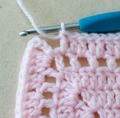 the crochet is being worked on with a needle