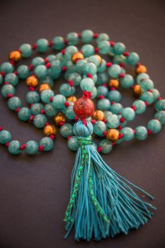 GREEN TARA MALA long necklace with silk tassel * the mala consists of a traditional number of stones in the amount of 108 pieces - lovely Spiritual Green Necklaces For Festivals, Green Beaded Mala For Festivals, Traditional Green Necklace For Meditation, Bohemian Jade Beaded Necklace With 108 Beads, Green Jade Beaded Necklace For Meditation, Green Spiritual Long Beaded Necklaces, Spiritual Green Long Beaded Necklaces, Spiritual Jade Beaded Necklaces For Meditation, Adjustable Turquoise Tassel Necklace For Gift