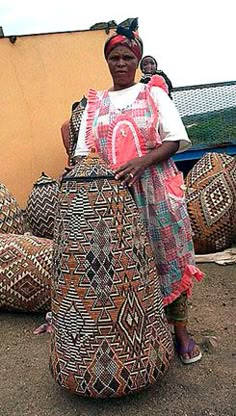 a woman is standing in front of large bags