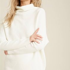 Super-Soft Cozy Sweater Featuring A Volume In The Body With A Slouchy Funnel Neckline To Contrast With Fitted Sleeves, And A Relaxed Silhouette. * Size Ratio: 3-3 (S/M-M/L) * Fabric Contents: 48%Viscose,27%Polyester,25%Nylon * Made In China * Model Is 5’9” And Wearing A S/M * Full Length: 30 White Relaxed Fit Cashmere Sweater, White Turtleneck Loungewear Top, White Turtleneck Top For Loungewear, Chic White Batwing Sleeve Sweater, Fall Cream Batwing Sleeve Top, Oversized White Fine Knit Tops, Winter White Turtleneck Top For Layering, Cozy Funnel Neck Sweater In Winter White, Cream Batwing Sleeve Sweater For Fall