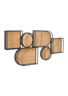 three metal and bamboo wall hangings with round wooden panels on the sides, one in black