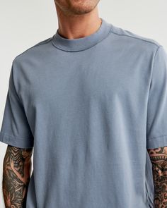 Our new short-sleeve tee in our softAF 180g fabric and vintage oversized-fit silhouette, featuring reverse seaming details, crew neckline and straight hem. Made in the same fabric as our Essential Tee but fits like our Premium Heavyweight Tee! Relaxed Fit Washed Blue T-shirt, Washed Blue Relaxed Fit T-shirt For Everyday, Relaxed Fit Washed Blue T-shirt For Everyday, Everyday Washed Blue Relaxed Fit T-shirt, Everyday Relaxed Fit Washed Blue T-shirt, Basic Washed Blue Relaxed Fit Tops, Casual Relaxed Fit Top With Ribbed Neckline, Relaxed Fit Top With Ribbed Neckline For Casual Gatherings, Washed Blue Relaxed Fit Short Sleeve Tops