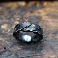 Black, twisted iron ring perfect gift for a man, boyfriend or husband. Made using traditional blacksmithing techniques of fire, hammer and anvil.  Surface texture is achieved through different shaped hammers and hand held chisels and profiling tools. The ring sealed with a clear wax for protection. US size- 10 1/2 Width -  8.2 mm Thickness- 3.5 mm This original handiwork can become a exclusive, nice piece of your style. Presented in a gift bag.  European & International orders are sent by Standa Unique Mens Rings, Iron Jewelry, Anniversary Gift For Husband, Iron Ring, Ring Hand, Anniversary Gifts For Husband, Gift For Husband, Men's Ring, Wedding Anniversary Gifts