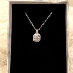 1 Carat Certified Moissanite Lab Created Diamond Set In Sterling Silver Plated In 18k White Gold With A Cushion Halo Set With More Sparkling Gems. The Necklace Pictured Is The Necklace You Will Receive, In The Gift Box Pictured. Sterling Silver Chain Measures 17.75” With A 2.36” Extender. Stone Weight: 1 Carat Stone Shape: Round Stone Dimension: 6.5mm Style: Cushioned Halo Stone Color: Diamond White Stone Clarity: Vvs1 Stone Grade: D Stone Cut: Brilliant Stone Type: Moissanite Metal Type: S925 S Cushion Halo, Halo Necklace, Diamond Set, White Stone, Lab Created Diamonds, Moissanite Diamonds, 1 Carat, Sterling Silver Chain, Diamond White