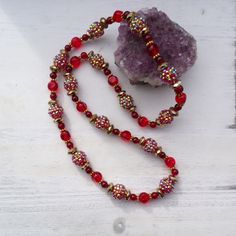 Red and gold pave beaded necklace. We used red glass beads, red pave beads and brass spacer beads. The red pave beads have a golden iridescent shift. Great vintage  style. Beautiful for Christmas. Pave Necklace, Pave Beads, Red Glass, Red And Gold, Vintage Stil, Spacer Beads, Bead Necklace, Chain Styles, Red Gold