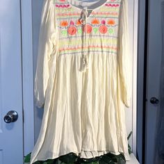 Nwt Boho Embroidery Blouse/Top With 3/4 Sleeves. Soft Comfortable Gauze Type Material With Bright Colored Embroidery Flowers Embellishments.Has A High Waste Design & Ties In The Front. Bundle (2) Or More Listings &Get 10% Off. Thank You For Stopping By & Have A Wonderful Day! Yellow Long Sleeve Embroidered Dress For Spring, Yellow Long Sleeve Embroidered Spring Dress, Long Sleeve Floral Embroidered Top For Beach, Cream Long Sleeve Top With Resham Embroidery, Cream Floral Embroidered Dress For Spring, Multicolor Long Sleeve Embroidered Top For Spring, Long Sleeve Floral Embroidered Top For Vacation, Multicolor Embroidered Long Sleeve Top For Spring, Long Sleeve Embroidered Top For Beach