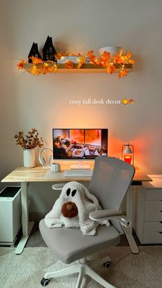 a chair with a stuffed animal on it in front of a computer desk and shelves