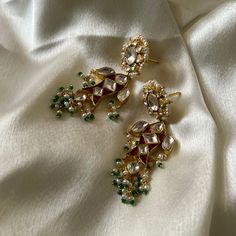 Elegant Jeweled Earrings For Diwali, Traditional Jeweled Dangle Danglers, Designer Tilla Earrings For Diwali, Festive Traditional Jeweled Pearl Earrings, Festive Elegant Designer Jhumkas, Elegant Designer Jhumkas For Festive Occasions, Elegant Designer Festive Jhumkas, Elegant Designer Jewelry For Festive Occasions, Elegant Designer Festive Jewelry