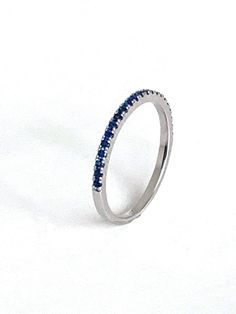 1/2 eternity sapphire fashion stack ring In 14K gold also available in emerald, ruby & diamond please inquire m Diamond Information: n/a Stone Information: 22 sapphires .26 cts Gold: white, yellow and rose gold In Stock: 1 available in 14k white gold Fine Jewelry Cubic Zirconia Stackable Half Eternity Rings, 14k White Gold Half Eternity Jewelry, Sterling Silver Stackable Half Eternity Rings, Formal Gemstone Stackable Rings With Round Band, Classic Stackable Round Cut Emerald Ring, Classic Stackable Emerald Ring With Round Cut, 14k White Gold Half Eternity Round Band, Silver 14k Gold Half Eternity Stackable Rings, Stackable Emerald Ring With Diamonds