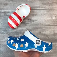 Brand New Crocs Classic American Flag Clog Toddler Size C7 Toddler Size C10 White Non-slip Clogs For Playtime, Non-slip White Clogs For Playtime, Summer Clogs With Round Toe For Playtime, Summer Playtime Clogs With Round Toe, Blue Non-slip Fun Clogs, Fun Blue Non-slip Clogs, Playful Clogs With Round Toe For Playtime, Playful Round Toe Clogs For Playtime, Playful Non-slip Clogs With Round Toe