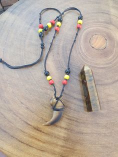 This necklace is made with a Resin Bear claw and timber beads. The string is 0.5mm black waxed string. The Tigers Eye Oblisque in video  is 51gm, 7.5cm x 2cm (Oblisque will vary for 2nd and 3rd items) Bear Claw Jewelry, Black Bear Decor, Claw Jewelry, Bear Claw Necklace, Claw Necklace, House Items, Bear Claw, Bear Claws, Bear Decor