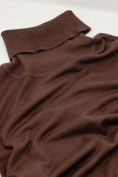 Introducing our Fine Knit High Neck Jumper in a warm and earthy brown shade – a testament to comfort and timeless style. This super-comfortable high neck sweater is delicately crafted in a very fine knit, ensuring a luxurious feel that's perfect for any occasion. The standard fit and rib detailing at the neck add a touch of refinement to this wardrobe essential.  Versatility meets sophistication as you can effortlessly pair this jumper with jeans or skirts, making it the go-to basic piece for your closet. The turtleneck neckline exudes elegance and warmth, while the long sleeves and bodycon fit contribute to a stylish and flattering silhouette.  Designed for daily wear, this Fine Knit High Neck Jumper seamlessly blends comfort with fashion. The fine knit composition, featuring 48% Viscose, High Neck Jumper, Fitted Jumper, High Neck Sweater, Brown Shades, Color Marron, Knitwear Tops, Medium Brown, Fit Style, Playsuit Jumpsuit