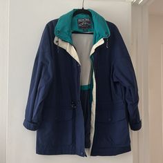 Retro Vintage Pacific Trail Windbreaker Waterproof Jacket Blue & Teal Size Large Retro/ Vintage Windbreaker. I Believe This Is From The Late 80’s Early 90’s. Colors Are Teal And Dark Blue. Buttons Have Cute Covers On Them. Pockets Hold A Lot. Has Zipper And Snap Buttons. Freshly Clean. Great For Cool Weather. Vintage Disclaimer* Items That Are Vintage Are Old They Are Not Brand New Condition But Are Clean And Still Wearable And In Good Condition. Please Ask If You Have Any Questions! Smoke Free Teal And Dark Blue, Retro Blue Cotton Track Jacket, Retro Blue Long Sleeve Windbreaker, Retro Blue Nylon Windbreaker, Pacific Trail, Vintage Multicolor Windbreaker With Pockets, Vintage Blue Pre-washed Outerwear, Vintage Windbreaker, Waterproof Jacket