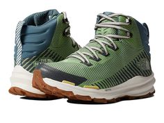 the north face men's back - to - wall hiker boot is shown in green and blue