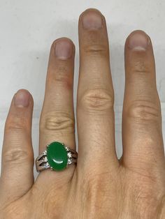 Vintage Lucky Green Nephrite Jade ring Fun jade is color enhanced Large green nephrite jade Ornate German Silver Vintage ring, does not tarnish, NOT sterling Size 5.5, 5.75, 6.25, 6.5 6.75, 7.75, and 9.25 All rings are shipped free in the US in a nice gift box. Check out our over a THOUSAND great reviews Engraving is $4 per letter and is not always perfect depending on the piece. It can take a few days if the jeweler is busy. This is payable to Paypal Judithsltd@gmail.com Fine Jewelry Green Oval Cabochon Rings, Green Emerald Oval Cabochon Ring, Green Emerald Ring With Oval Cabochon, Green Cabochon Fine Jewelry Rings, Green Cabochon Rings Fine Jewelry, Green Oval Gemstone Rings, Green Oval Cabochon Ring For Anniversary, Oval Green Opal Gemstone Ring, Green Jade Round Stone Jewelry